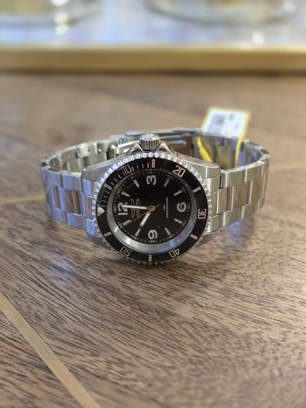 Invicta Silver Stainless Steel Watch with Black Dial and Bezel